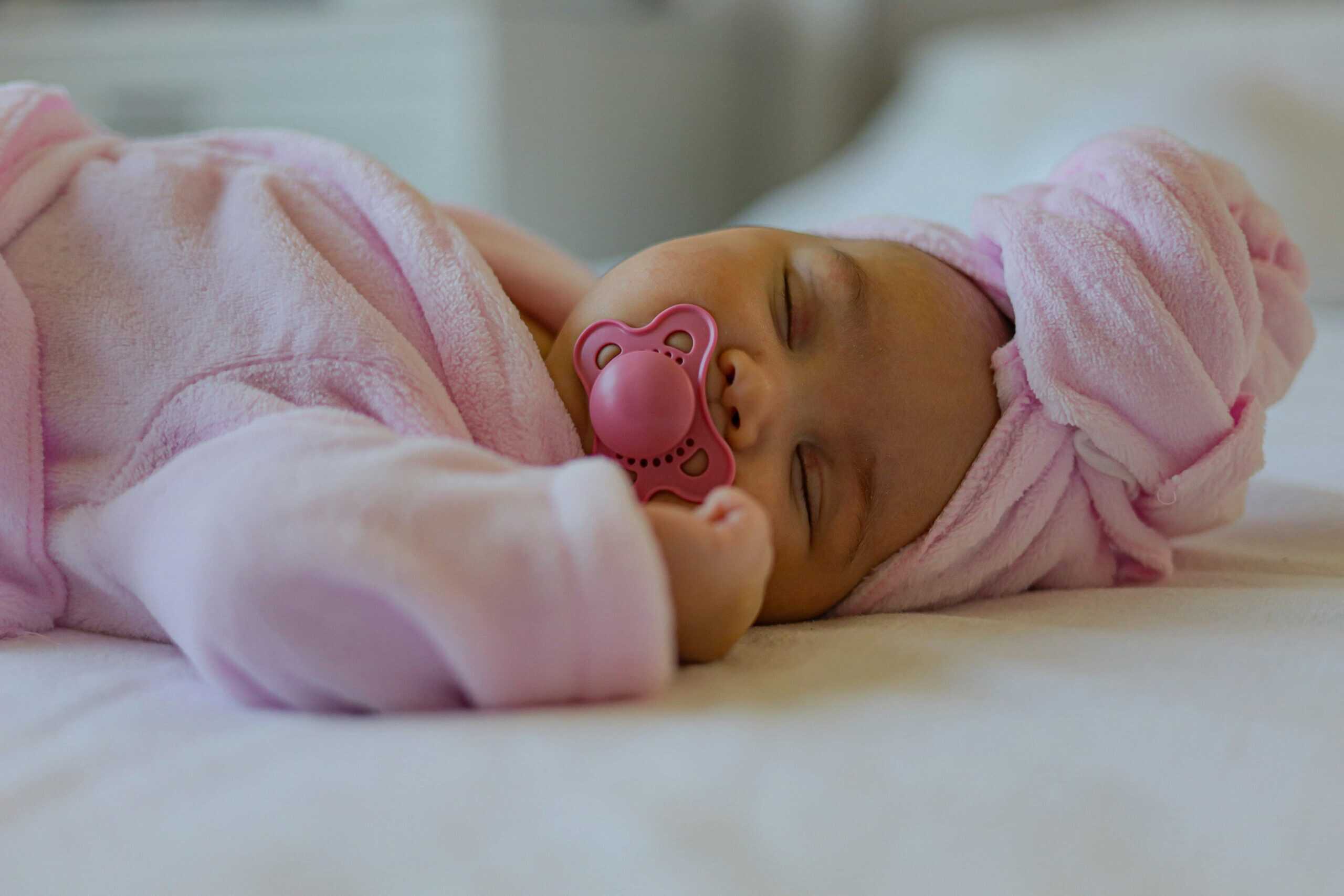 baby sleeping with pacifier