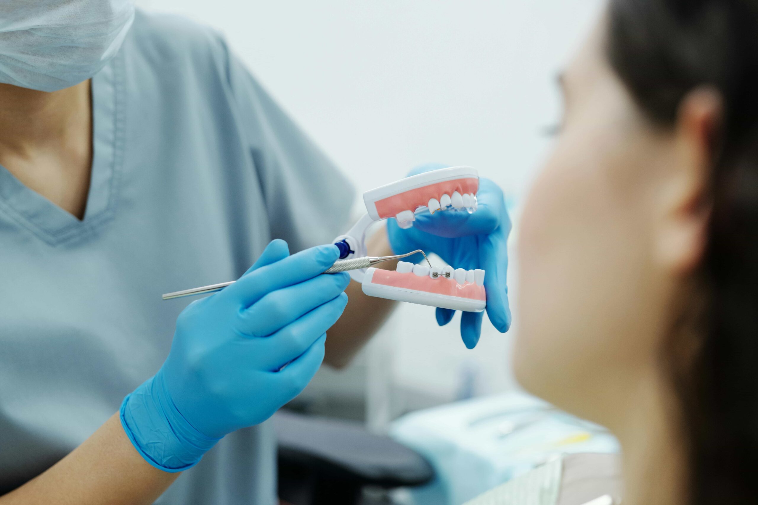 orthodontist showing patient braces