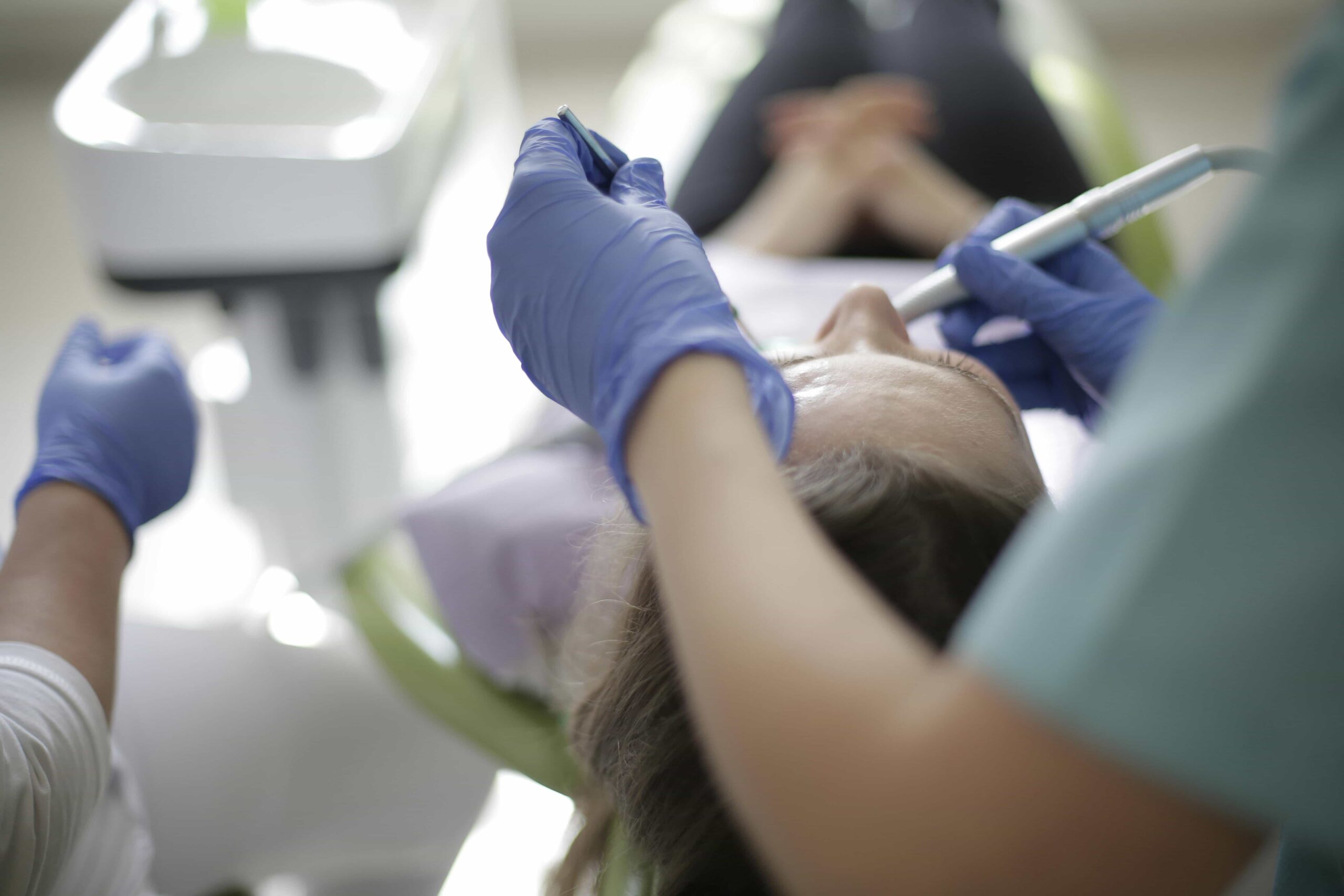orthodontist working on patient